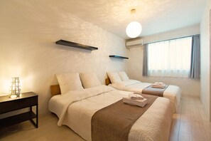 ファミリー アパートメント 2 ベッドルーム | 2 室のベッドルーム、遮光カーテン、WiFi (無料)、ベッドシーツ