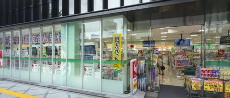 A store with large glass windows and a clear view of the interior.