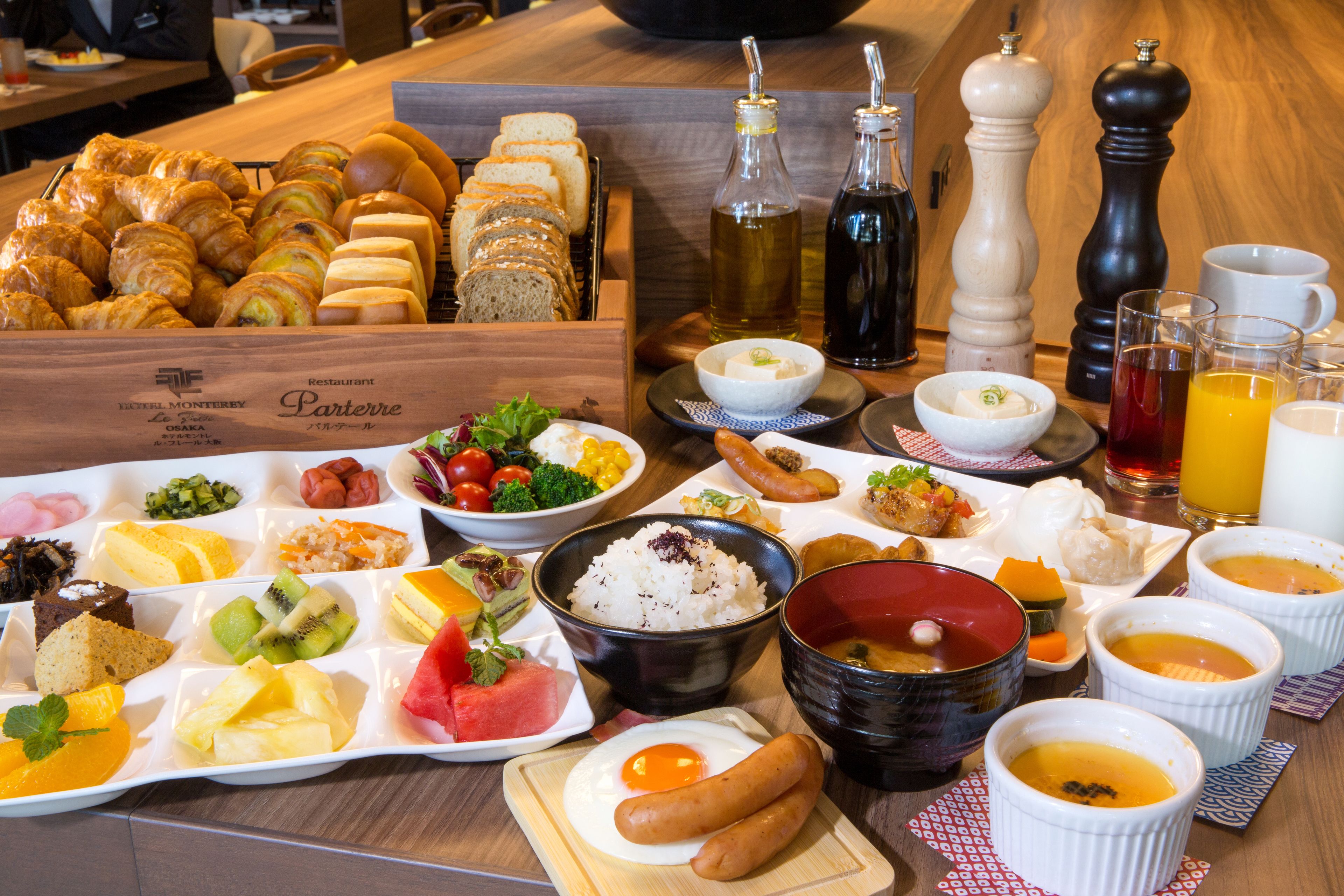 A breakfast buffet with various food items and condiments.