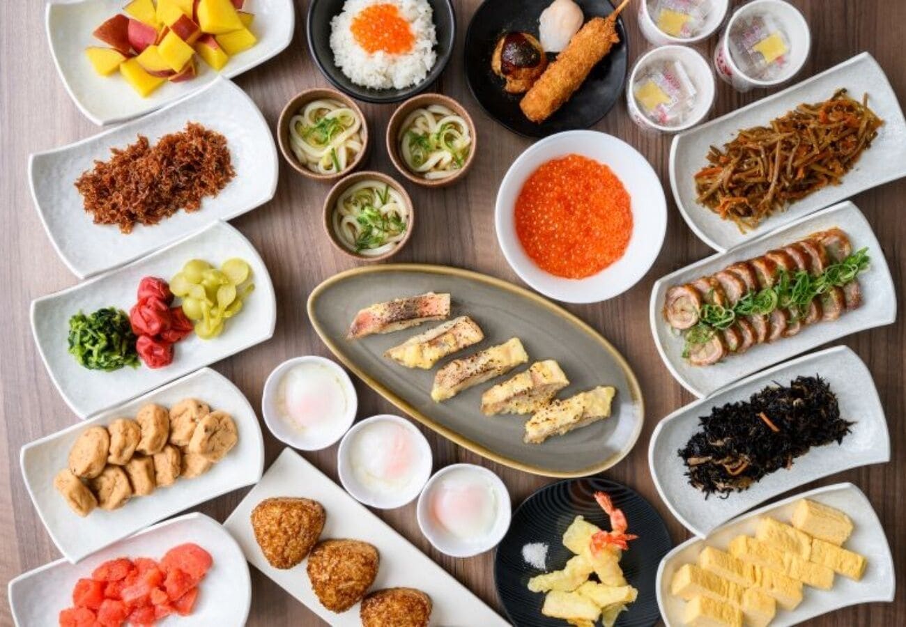 A variety of dishes arranged on multiple plates, suggesting a meal setting.