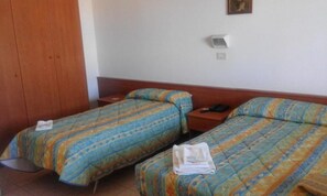 Economy Triple Room | Minibar, desk, laptop workspace, WiFi