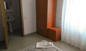 Economy Double Room Single Use | Minibar, desk, laptop workspace, WiFi