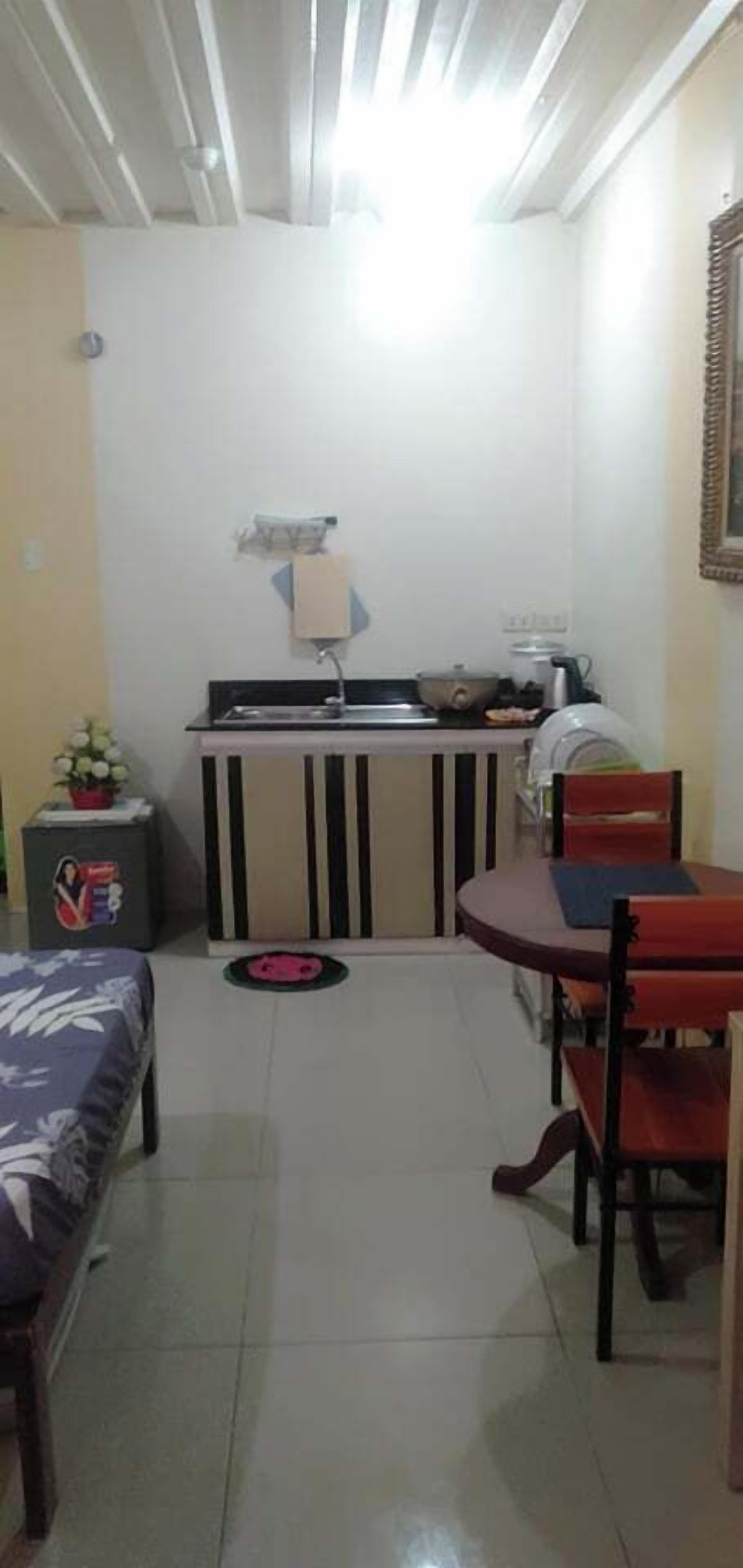 full-sized fridge, microwave, stovetop, coffee/tea maker