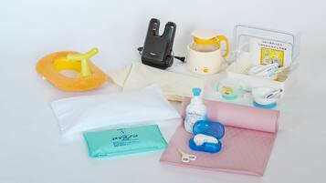 A baby changing station with a yellow and white sponge, a black and white baby bottle, a baby bottle brush, a baby bottle with a yellow cap, a baby bottle with a white cap, a baby bottle with a blue cap, a baby bottle with a purple cap, a baby bottle with a yellow cap, a baby bottle with a white cap, a baby bottle with a blue cap, a baby bottle with a purple cap, a baby bottle with a yellow cap, a baby bottle with a white cap, a baby bottle with a blue cap, a baby bottle with a purple cap, a baby bottle with a yellow cap, a baby bottle with a white cap, a baby bottle with a blue cap, a baby bottle with a purple cap, a baby bottle with a yellow cap, a baby bottle with a white cap, a baby bottle with a blue cap, a baby bottle with a purple cap, a baby bottle with a yellow cap, a baby bottle with a white