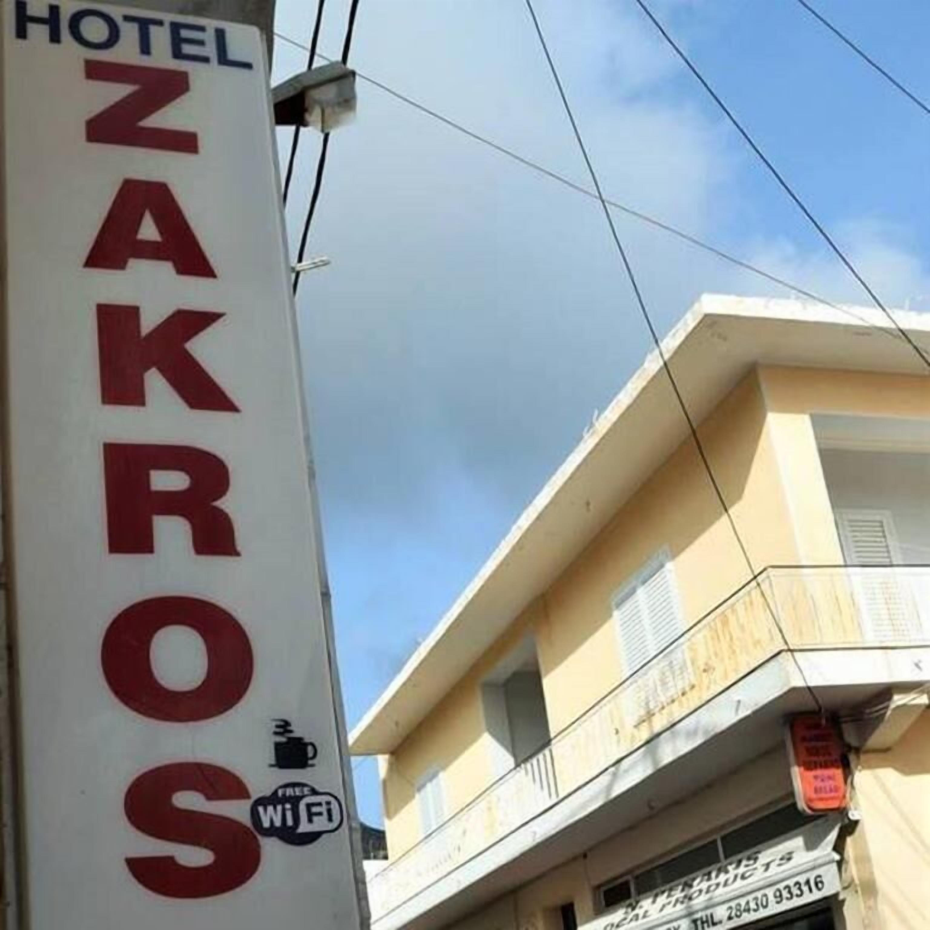 A hotel sign with "HOTEL ZAKROS" and a Wi-Fi symbol.