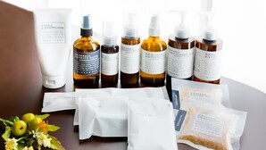 A variety of skincare products including face washing foam, herbal shaving foam, and moisturizing creams, along with bath salts and other toiletries. - The One Osaka Nipponbashi East (Osaka)