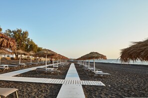 Private beach, free beach cabanas, sun-loungers, beach umbrellas - Costa Grand Resort & Spa (Santorini)