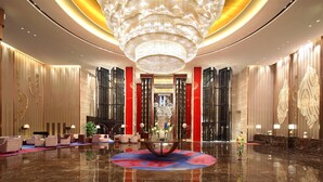 A spacious lobby with a large chandelier, seating areas, and a reception desk. - Wanda Realm Anyang (Anyang)