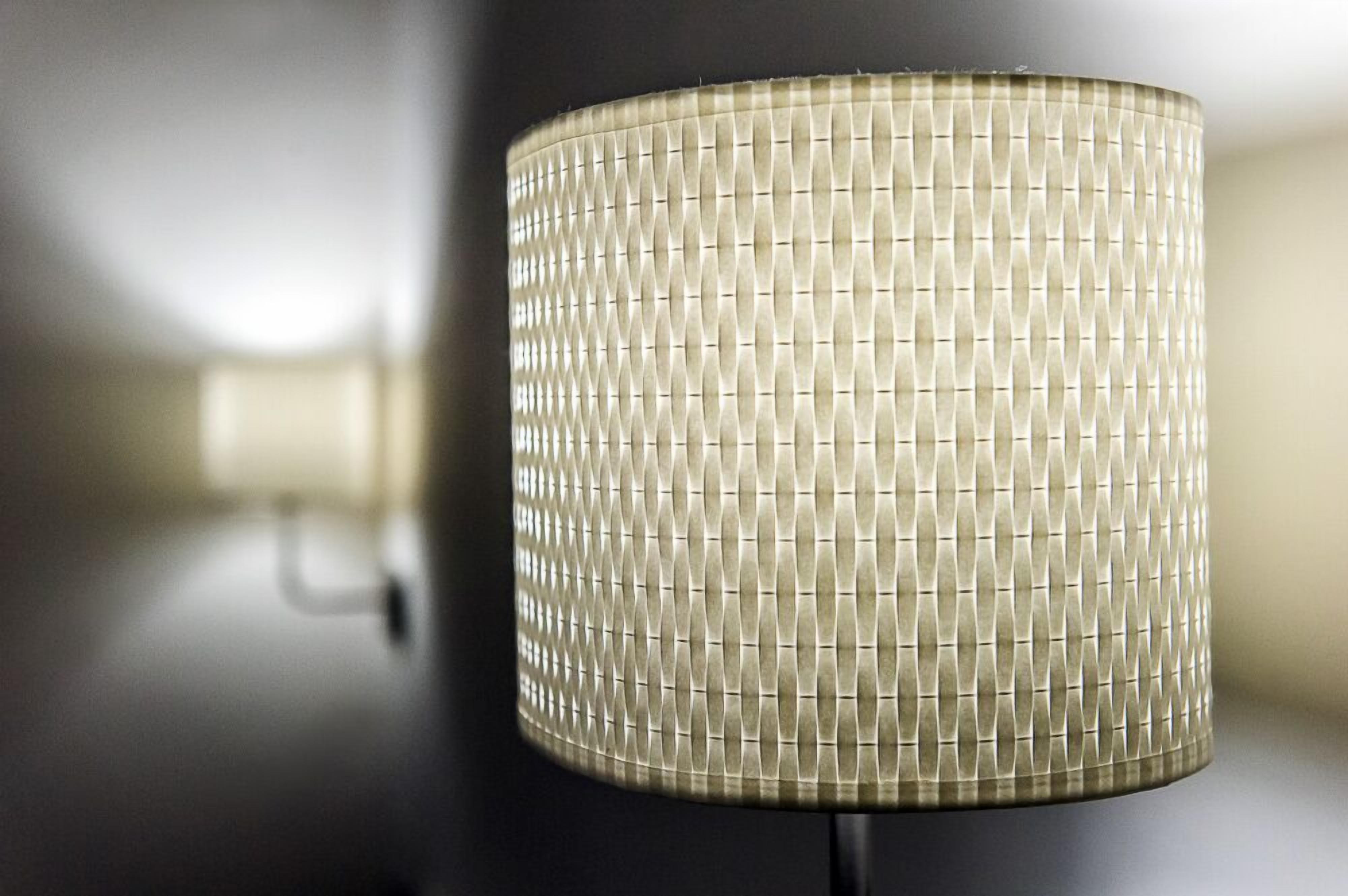 A cylindrical lamp with a textured surface.