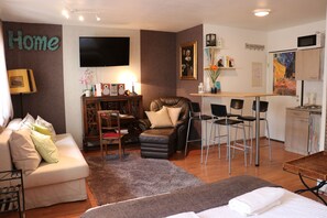Elite Studio | Desk, laptop workspace, iron/ironing board, cribs/infant beds