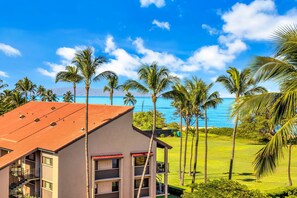 A building with a red roof, multiple windows, and a balcony. - Penthouse Oceanview Vistas (Kihei, Maui)