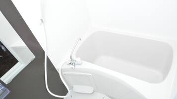 Separate bathtub and shower, free toiletries, hair dryer, slippers