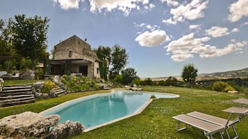 Seasonal outdoor pool, a natural pool, pool loungers