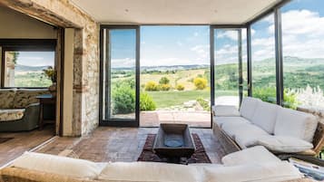 Exclusive Villa, 5 Bedrooms, Pool View | Living area | 21-inch LED TV with cable channels, fireplace