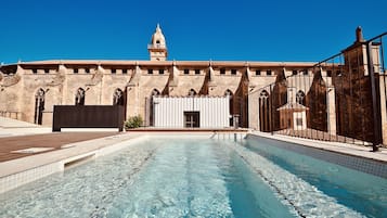 Seasonal outdoor pool, open 10:00 AM to 10:00 PM, pool loungers