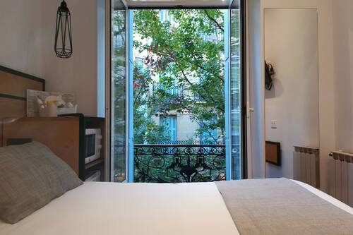 Economy Double Room, Balcony, City View | Down duvets, desk, iron/ironing board, free WiFi