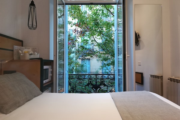 Economy Double Room, Balcony, City View | Down comforters, desk, iron/ironing board, free WiFi