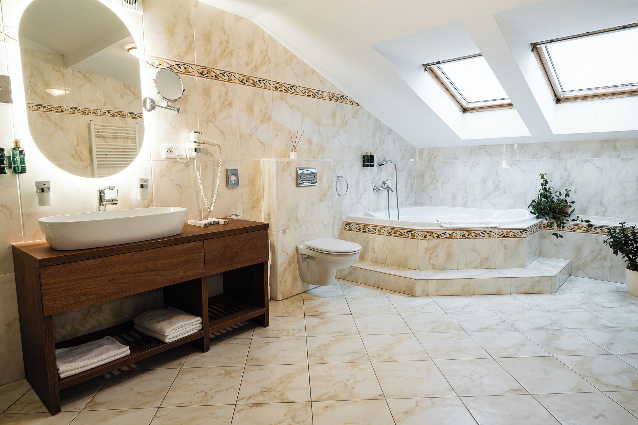 comfort suite | bathroom | designer toiletries, hair dryer, bathrobes, slippers