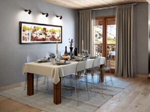 A dining area with a table set for six, clear chairs, a white tablecloth, and a framed picture above. - Aux Pieds du Roi (Valtournenche)