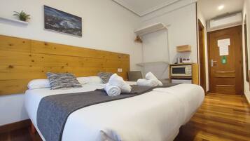 Down duvets, desk, blackout curtains, iron/ironing board