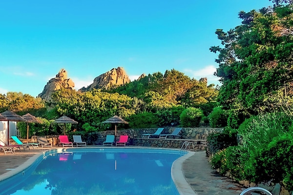 Outdoor pool, open 9:00 AM to 9:00 PM, pool umbrellas, pool loungers