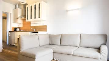 Appartamento, 1 camera da letto | Area soggiorno | TV a schermo piatto