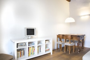 Apartment, 1 Bedroom | Living room | Flat-screen TV