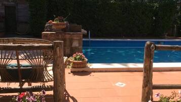 Seasonal outdoor pool, open 9:00 AM to 5:30 PM, pool umbrellas