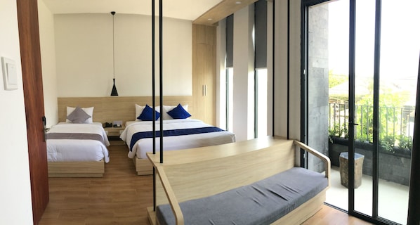 A modern hotel room with two beds, a balcony, and large windows.