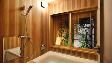 Separate tub and shower, free toiletries, hair dryer, slippers