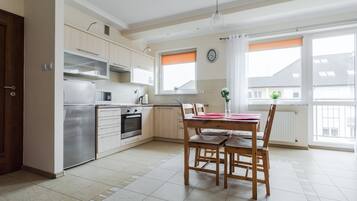 Deluxe Apartment, 1 Bedroom, Balcony (VIP) | Private kitchen | Fridge, microwave, stovetop, electric kettle