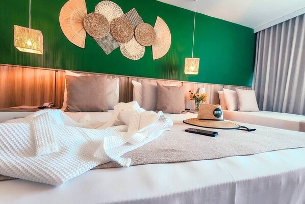 Deluxe Triple Room, Partial Sea View | Bathroom | Separate bathtub and shower, jetted bath, hair dryer, towels