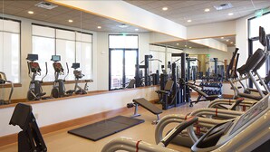 A gym with treadmills, elliptical machines, and weight equipment. - Lost Boy's Hideaway (Kissimmee)