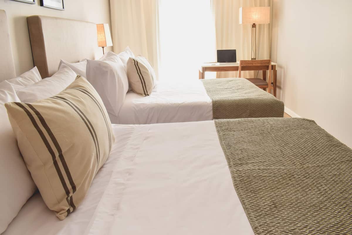Family Room | 1 bedroom, premium bedding, down comforters, minibar