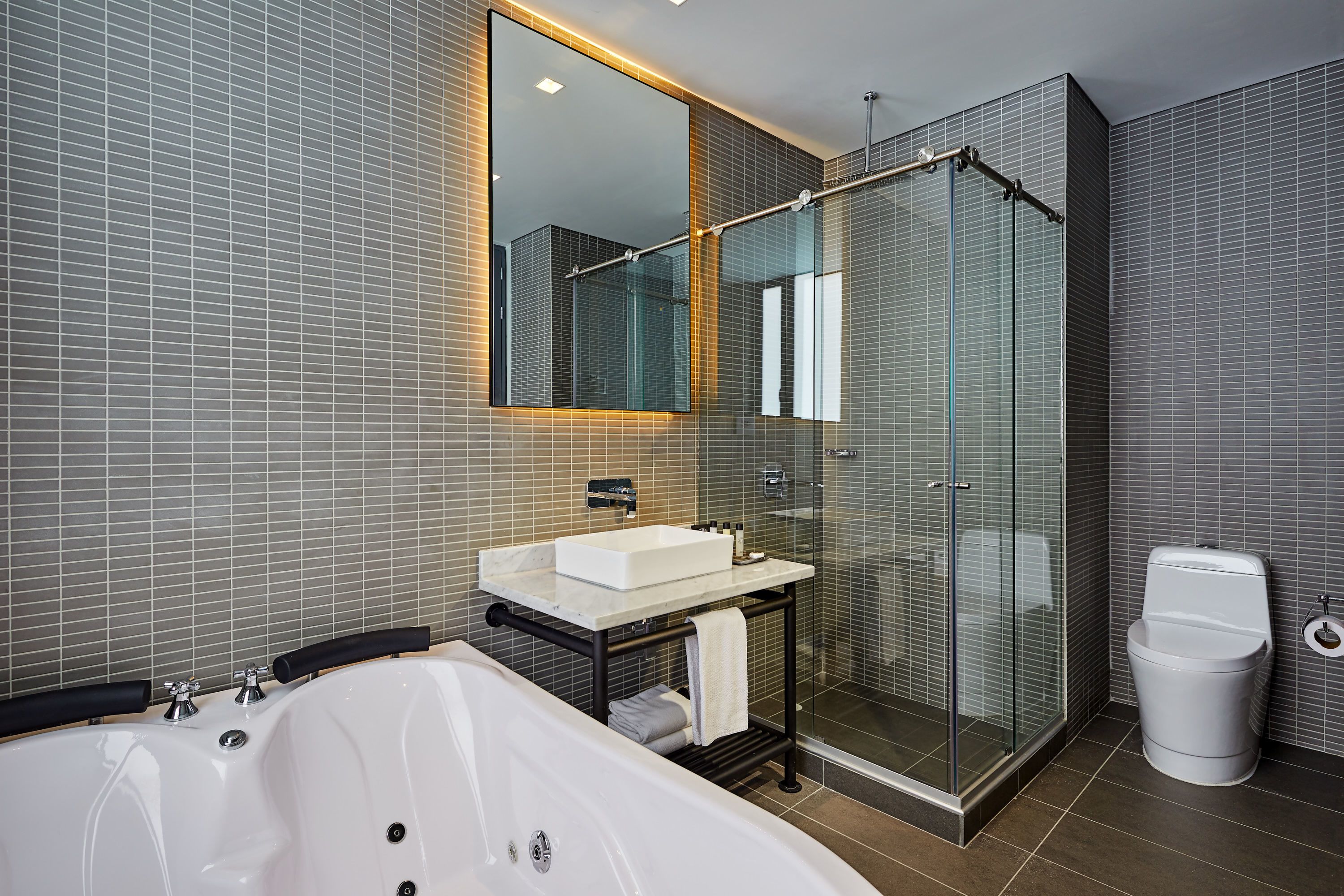 junior suite, 1 king bed, jetted tub, mountain view | deep-soaking bathtub