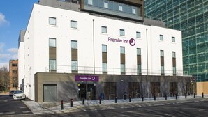 A modern Premier Inn building with a flat facade, large windows, and a parking area with bollards. - Premier Inn Southampton - Cumberland Place (Southampton)