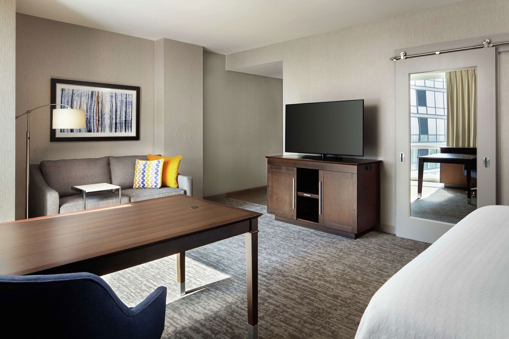 Desk, laptop workspace, blackout drapes, iron/ironing board