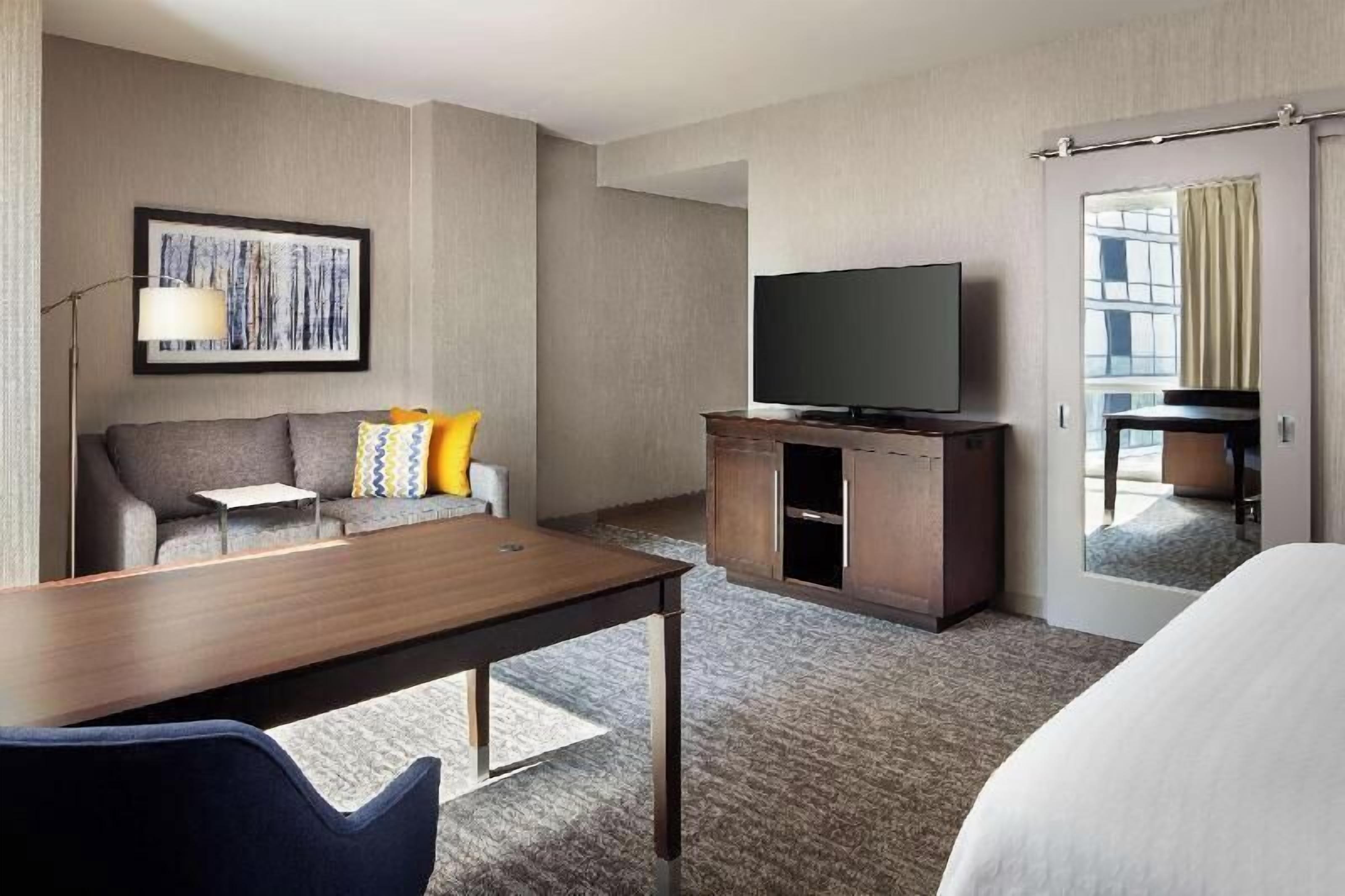 Desk, laptop workspace, blackout drapes, iron/ironing board