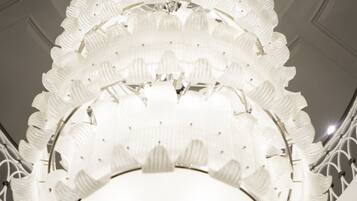 A ceiling with a circular, ribbed design and a central light fixture.
