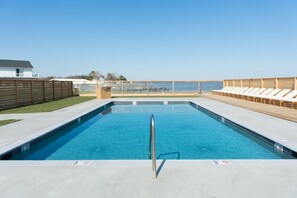 Seasonal outdoor pool, pool umbrellas, pool loungers