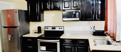 Executive Apartment, 1 Bedroom, Kitchen, Executive Level | Private kitchen | Full-size fridge, microwave, oven, stovetop