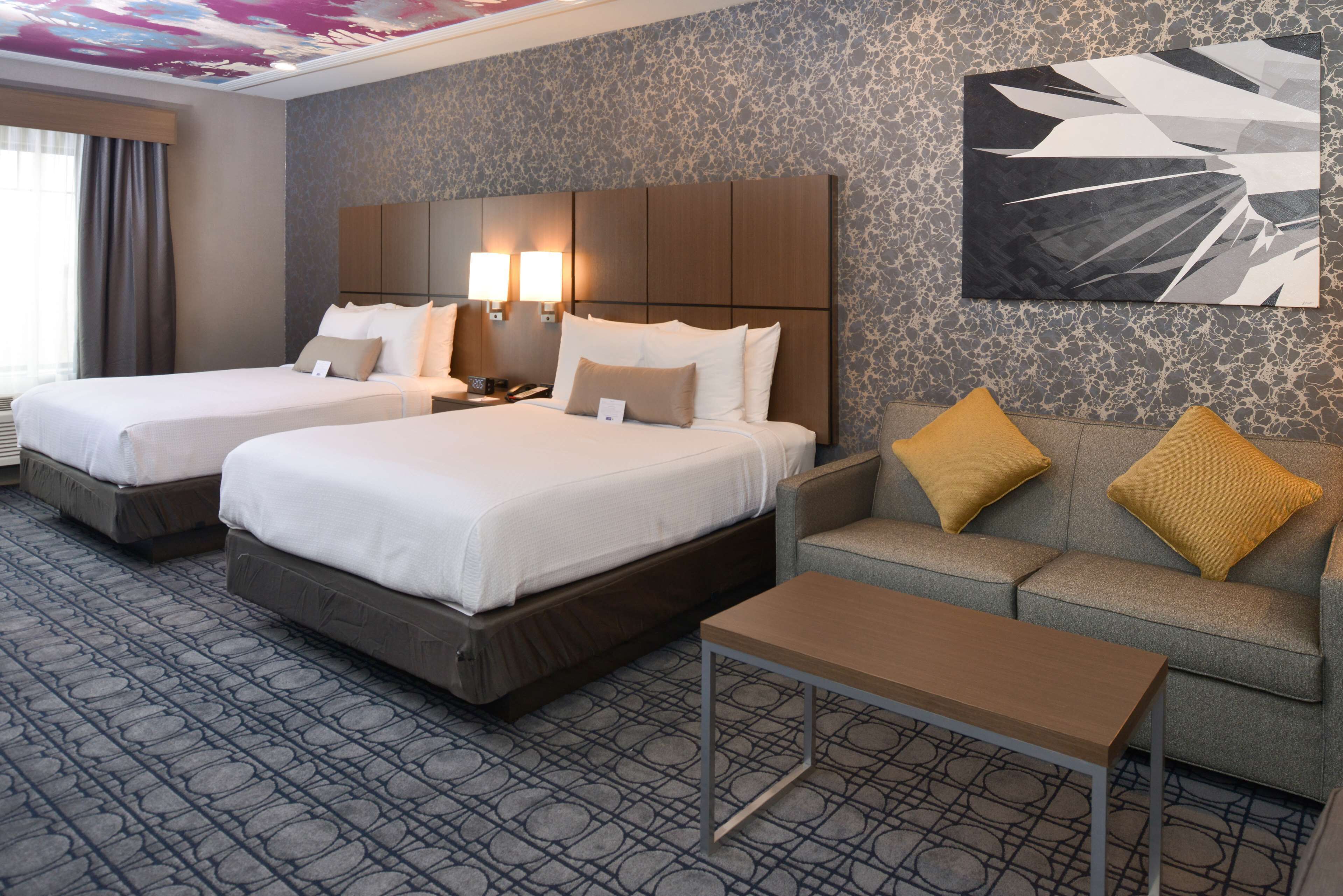 pillow-top beds, desk, blackout curtains, soundproofing