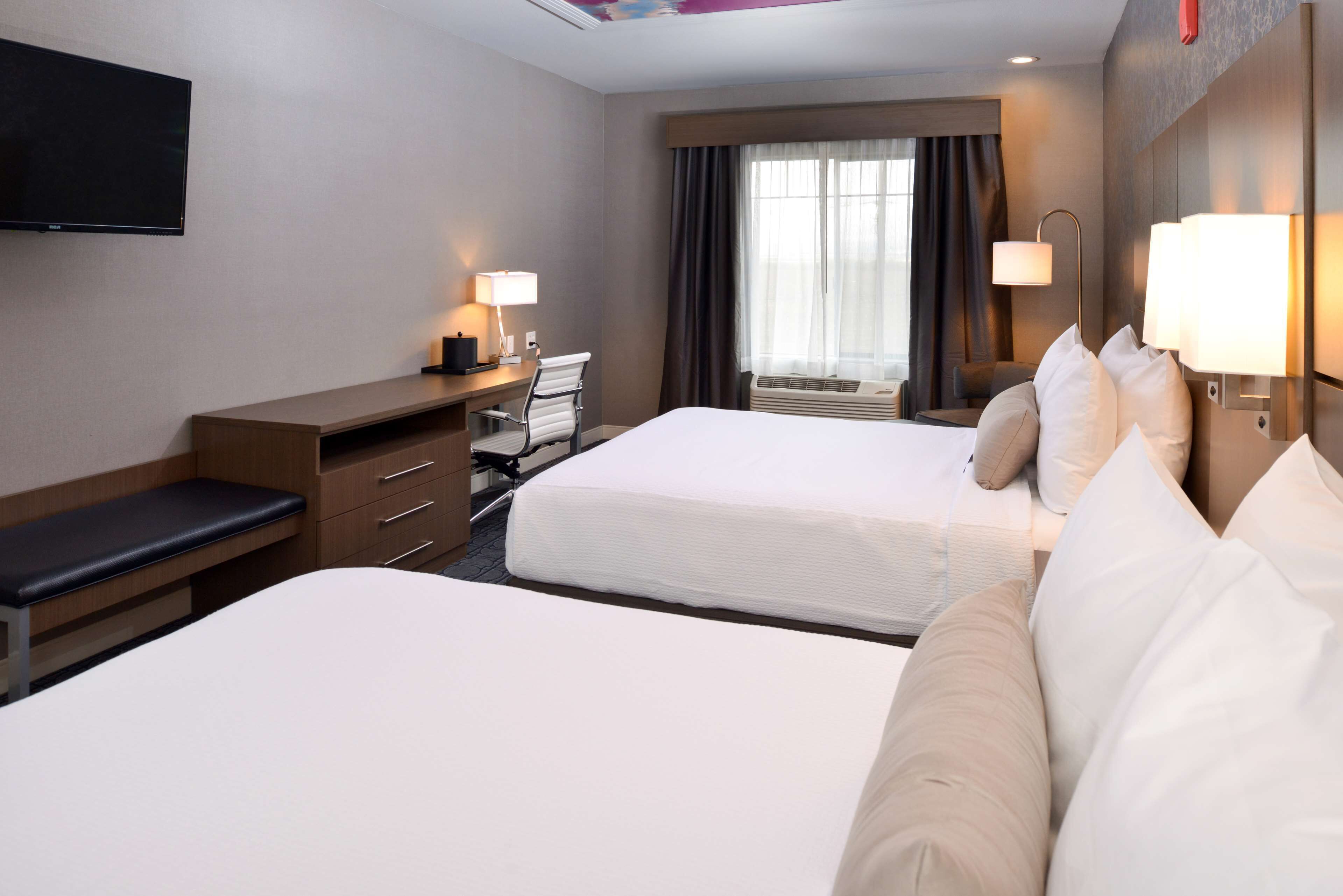 pillow-top beds, desk, blackout curtains, soundproofing