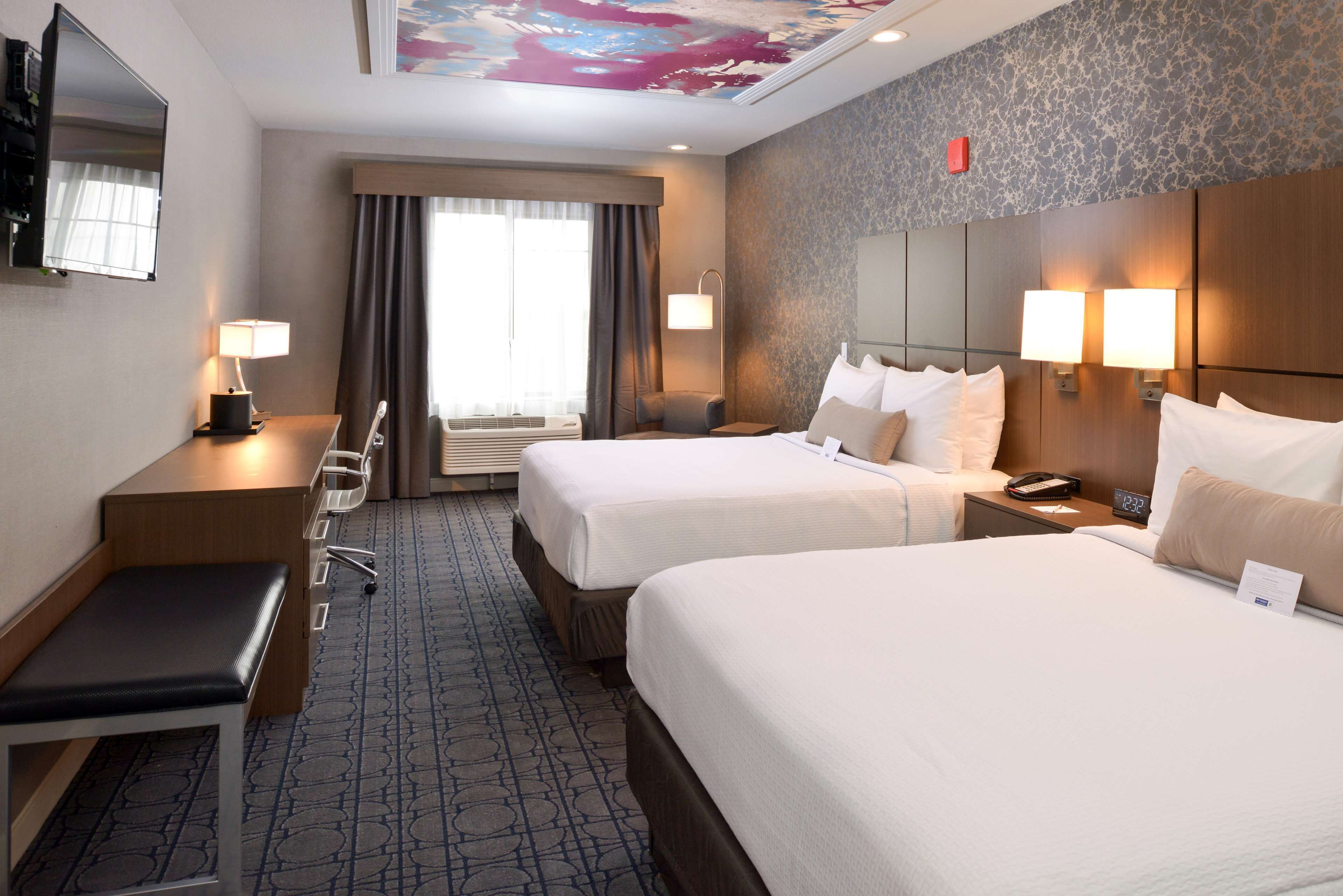 pillow-top beds, desk, blackout curtains, soundproofing