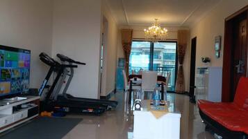 Three-Bedroom Apartment | Living room | TV
