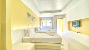A hotel room with two beds, a television, and a window with curtains. - Kuapa Resort (Takua Pa)