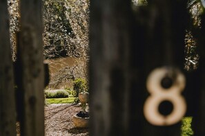 Stroll along the beautifully maintained garden pathway to a charming residence.