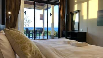 Beachfront, 2 Bedroom, Pool Villa | 2 bedrooms, individually decorated, individually furnished, desk