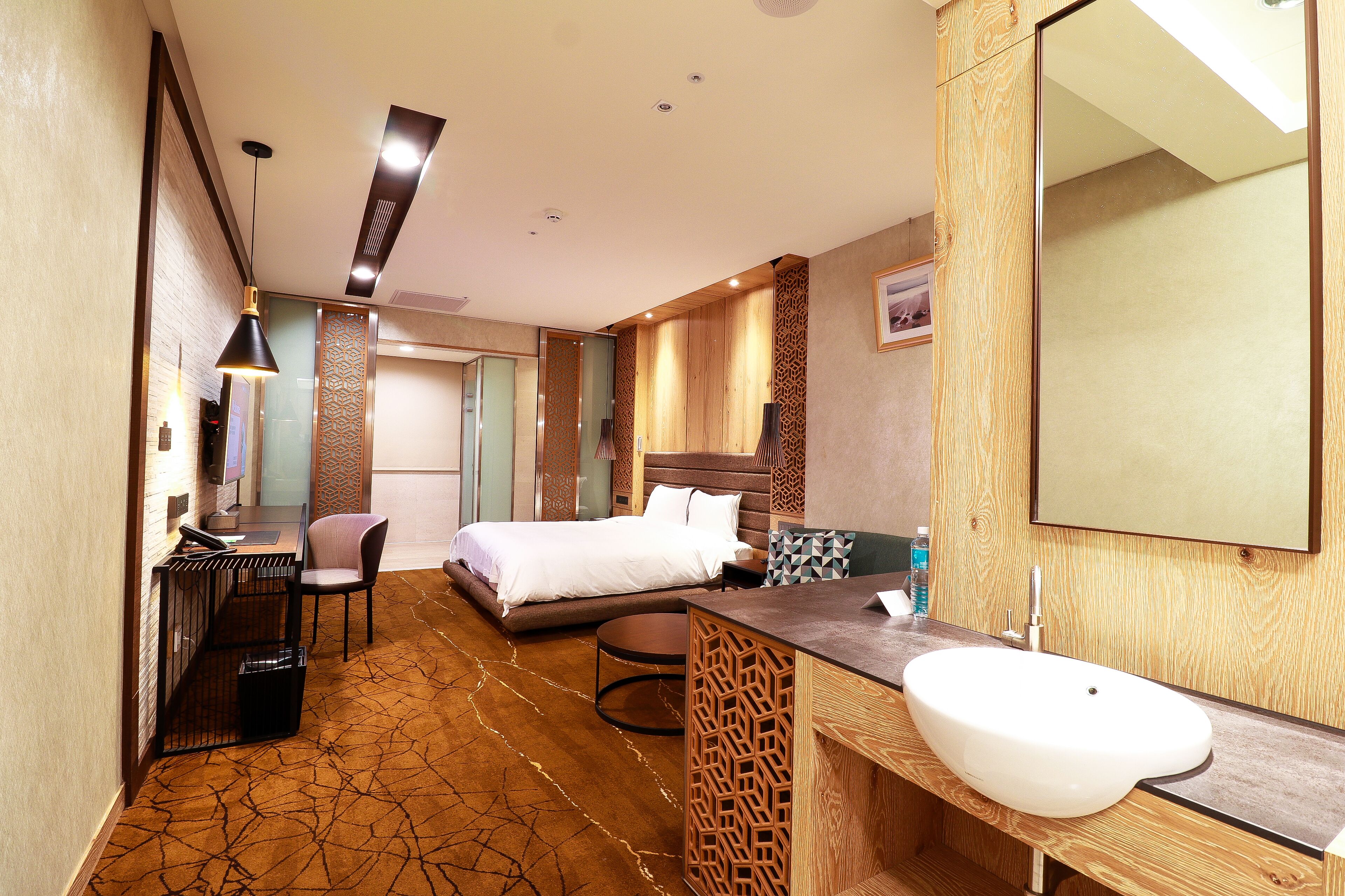 deluxe room, 1 queen bed, no windows | 1 bedroom, in-room safe, desk, blackout curtains