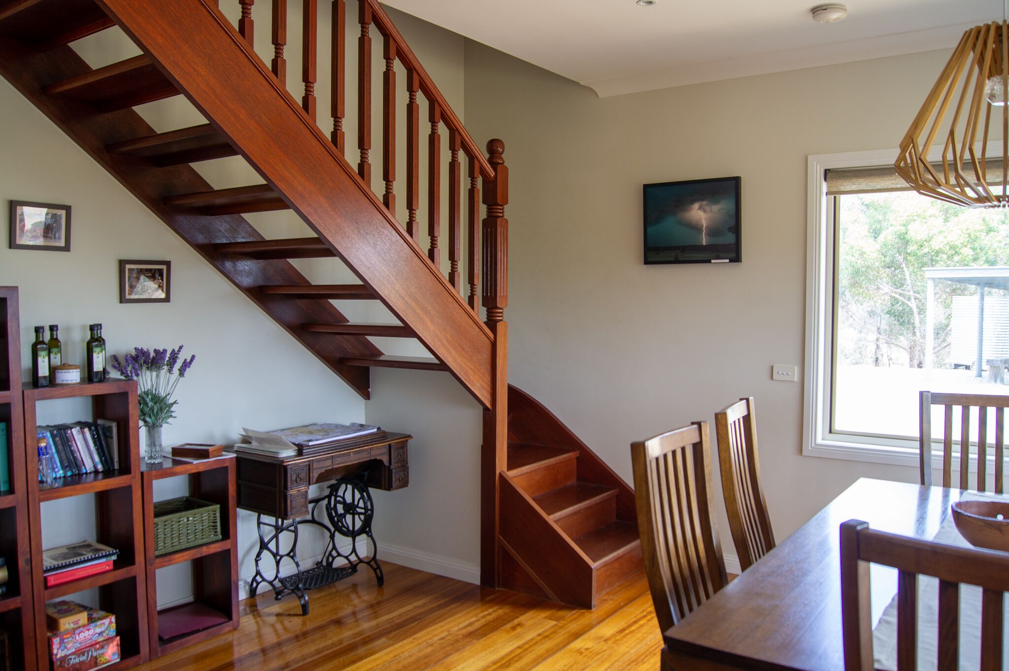 A staircase with wooden railings leading to an upper floor.